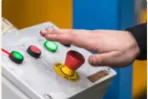 Facebook ad photo of an operator at a machine control panel