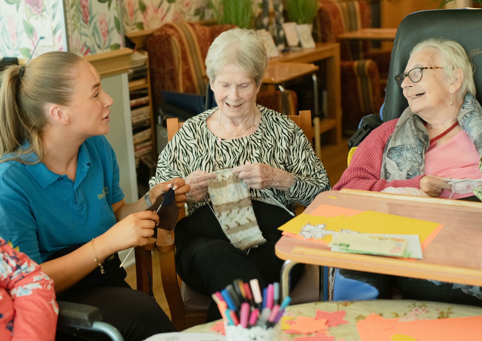 A caregiver with residents in a long-term care community